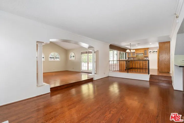 open den with entrance to massive bonus room