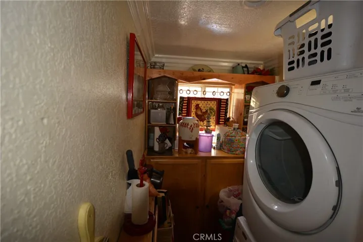 Large walk in pantry/laundry room with cabinetry
