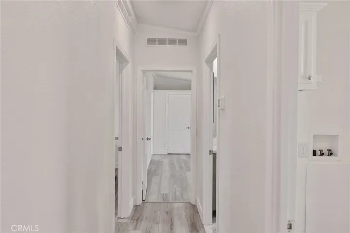 Hallway leading to second bedroom/bath and primary bedroom
