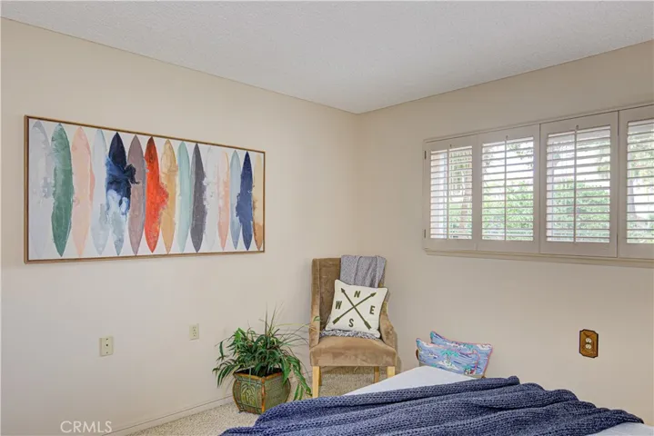 Secondary bedroom has room for a small desk or reading area.