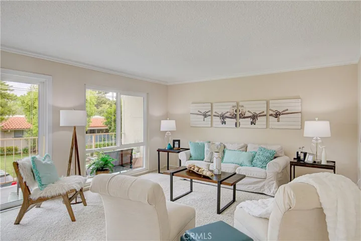 Walls of windows illuminate the living room.