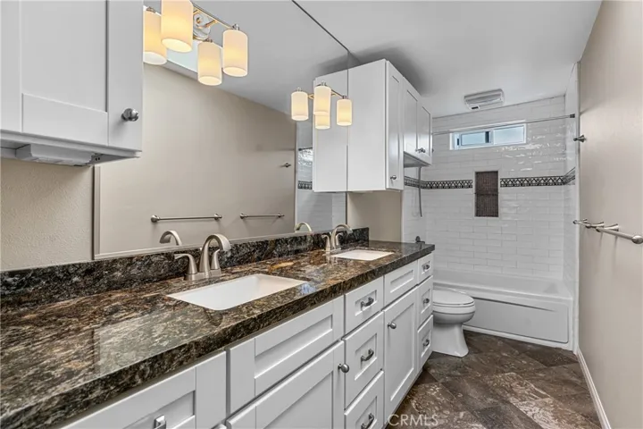 Prmary Bathroom with Spa Tub, Dual Sinks, and lots of Storare