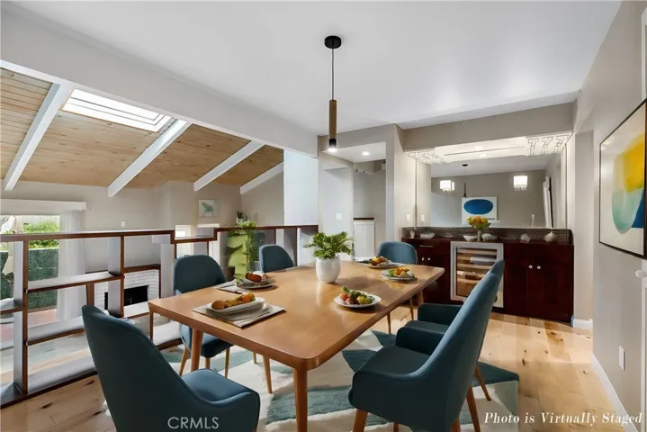 Dining Area overlooking Living Room. This Photo is virtually staged.