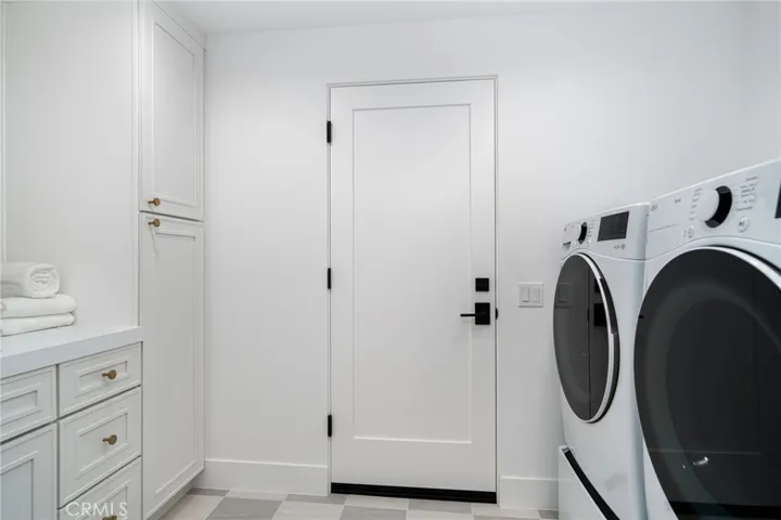 Large Laundry Room and Pantry - entry to garage