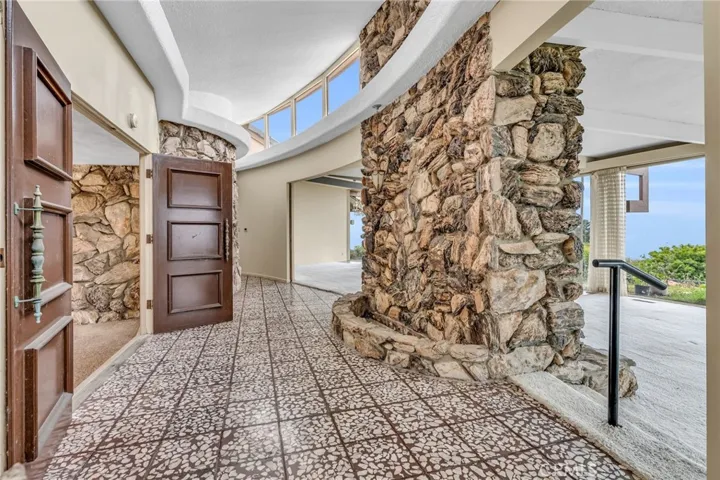 Entry with rock waterfall feature.