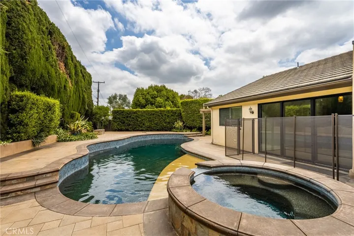 Pebble Tech Pool with Raised Spa and Ample Decking