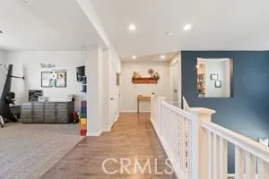 Landing w/view of playroom and Loft