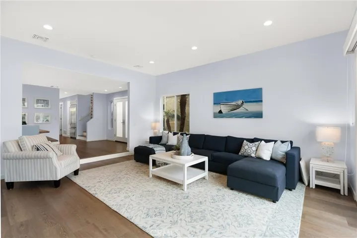  and elegance to his living room which flows from the formal dining room.