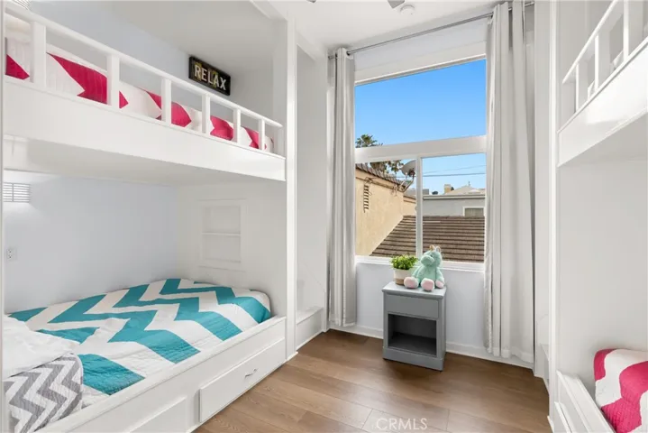 With soaring ceilings this 4 bunkbed room, with built-in steps, offers versatility & great options.