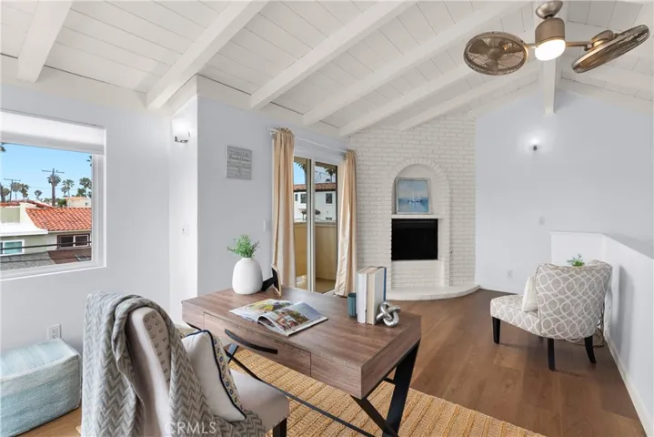 The loft features the 3rd fireplace of the home, ocean views and a private balcony.