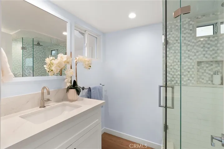 This fully updated glass enclosed shower is located downstairs, ideal for that quick rinse after the spa or beach day.