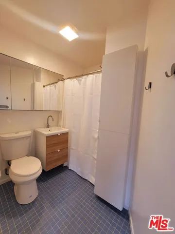 Downstairs 3/4 bathroom with new vanity, mirror & toilet
