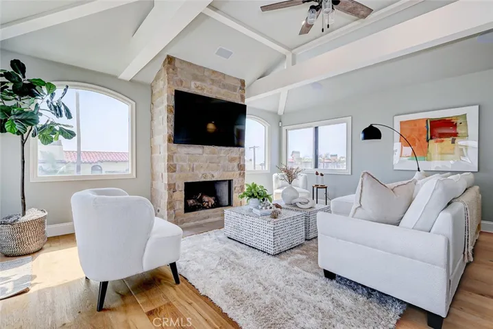 Living room features high ceilings, fireplace and expansive views.