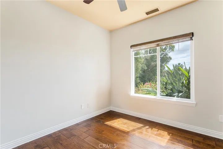 Bedroom #2 with view windows, ceiling fan and direct access to 3rd bath.