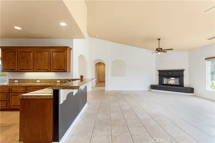 Family living area is open to the kitchen, which also has bar stool seating area.