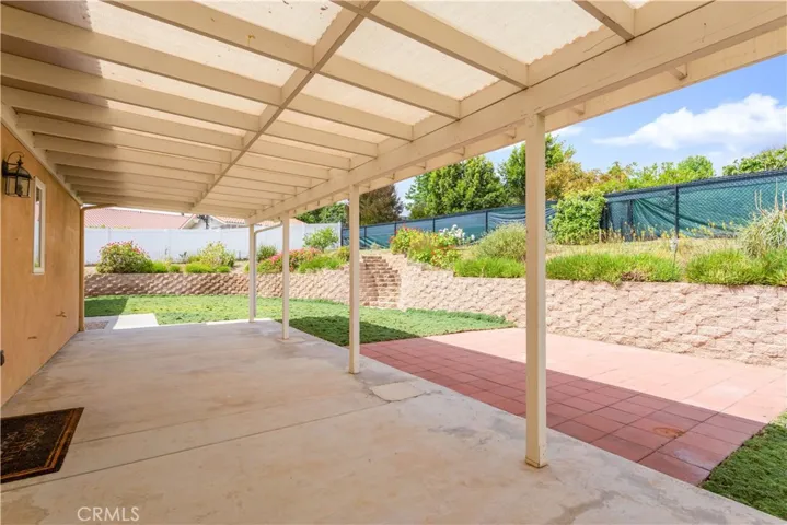 Backyard is west-facing and has large covered patio.