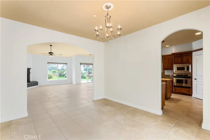 View from formal dining room into family living area and kitchen.
