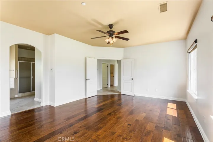 Primary bedroom has double door entry.