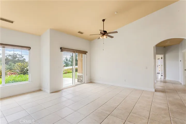The family living area has extended room, view windows and access to the east facing front patio.