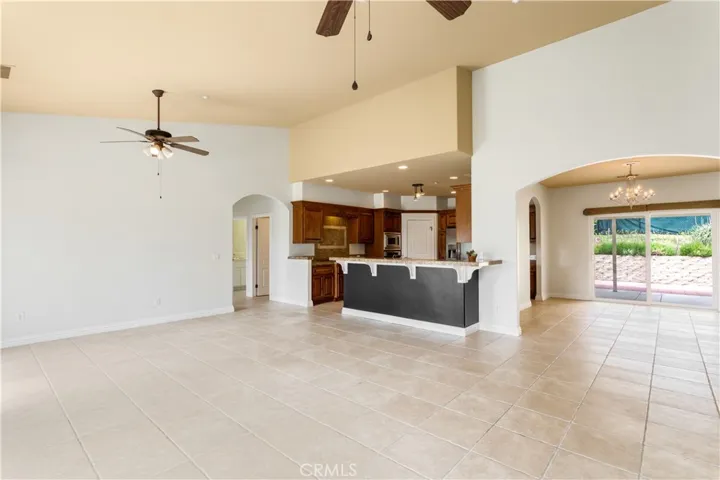 View from family living area into kitchen and formal dining room.