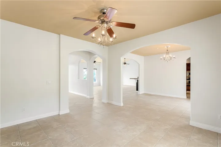 View of the open floor plan from the formal living room into dining room and family living area.