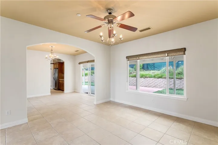View from formal living room into dining room and then kitchen.