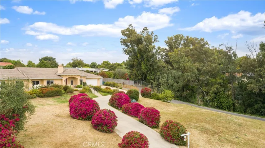 Home sits up above the street, gaining gorgeous views.