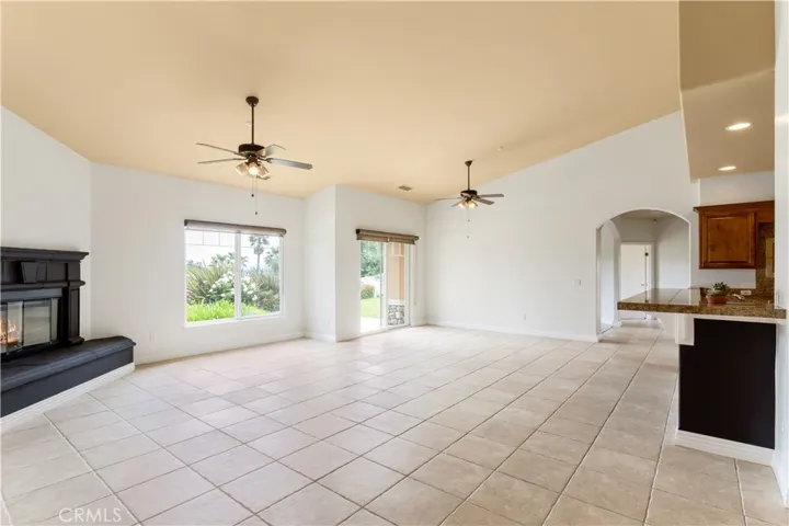 From formal entry, to your left is the open great room of family living area.