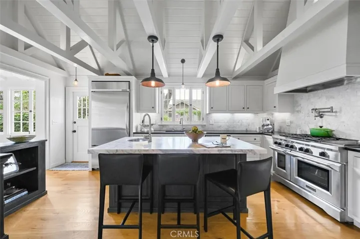 The island is a cozy spot to hang with the cook in the family or read the morning paper with a view to the neighborhood.