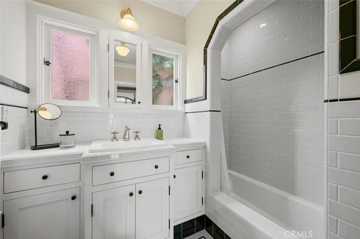 Original arched opening above tub & shower.