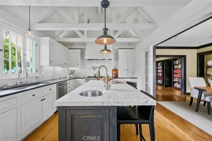 The kitchen opens to the dining room.