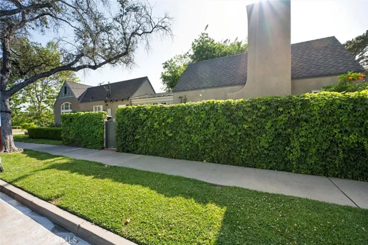 A privacy wall along French Street is covered in English ivy and hides the kitchen garden.