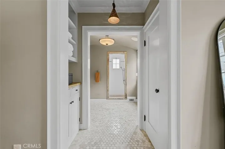 Added Main bath with storage. French door to right leads to outdoor shower.