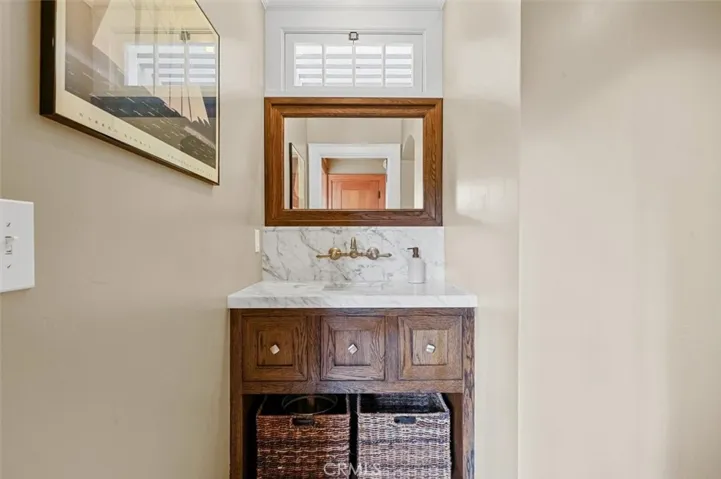 Guest powder room with marble counter.