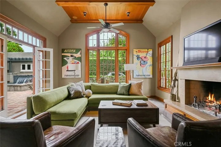 Wowzier!Step down to this amazing Family room with twin arched window, 12' tall ceiling and concrete floors.