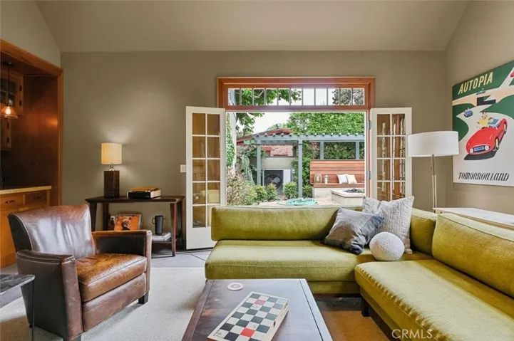 Bifold French doors open completely to the backyard.
