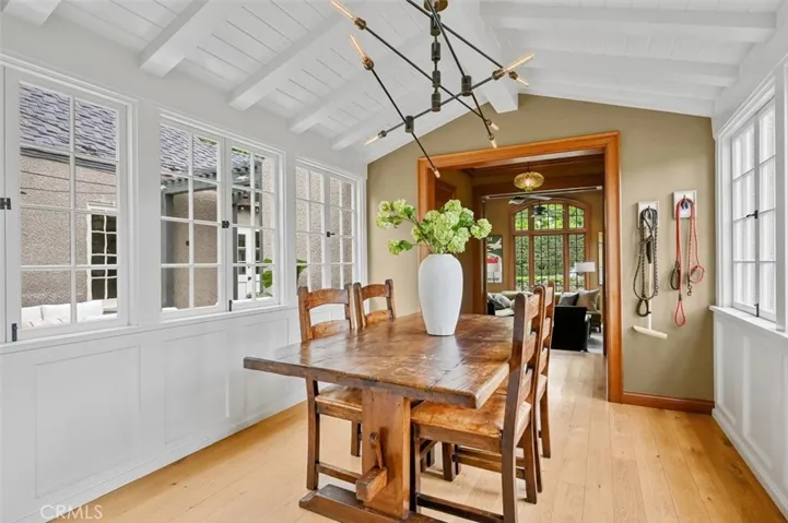A very English feeling nook with paned windows on 2 sides and open beam ceiling. This room connects the kitchen to the family room.