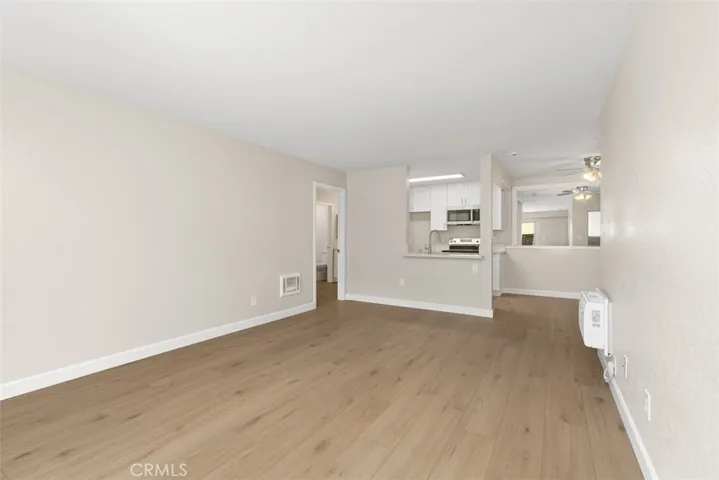 Spacious living room with wall heat and A/C including an extended counter bar that would accommodate a few bar stools