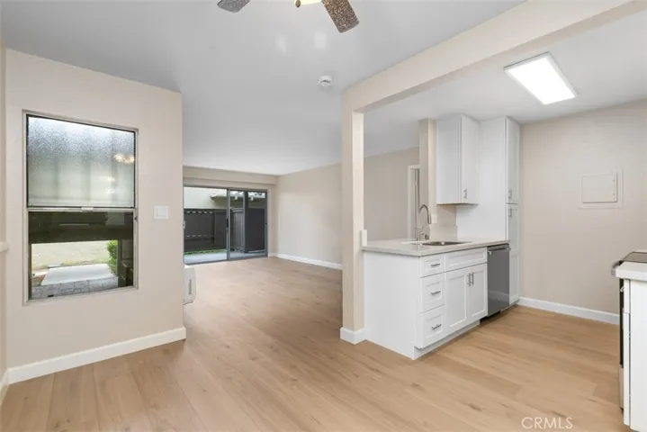 Dining room adjacent to kitchen with open view to the living room and patio