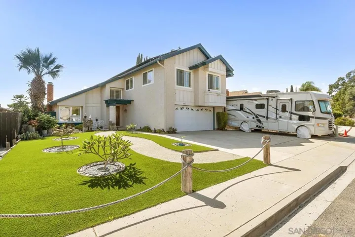 Low-Maintenance Landscape - Enjoy a beverage and chatting with neighbors from your front deck