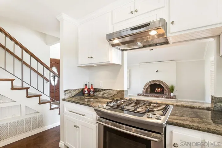 Pass-through / Counter Area to chat with everyone in Living Room and so whomever is cooking, can watch the TV too!