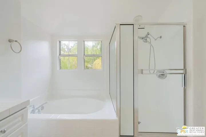 Soaking tub and separate shower.