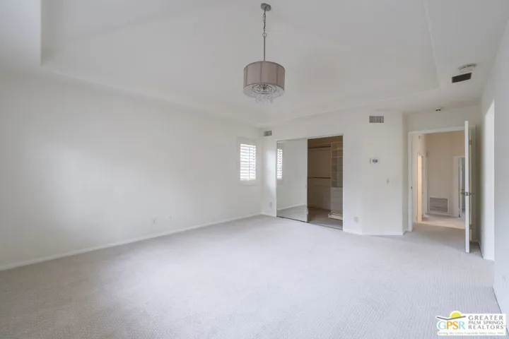 Primary suite with large walk-in closet.