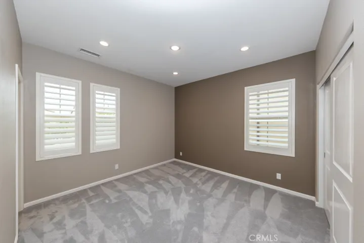 bedroom 2, top of stairs on right, boasts private ensuite bathroom