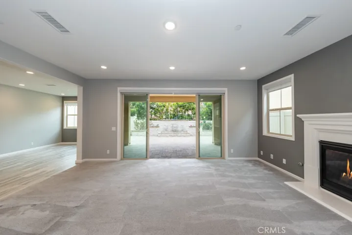  looking from den out to backyard and back wall water fountain with three waterfall features