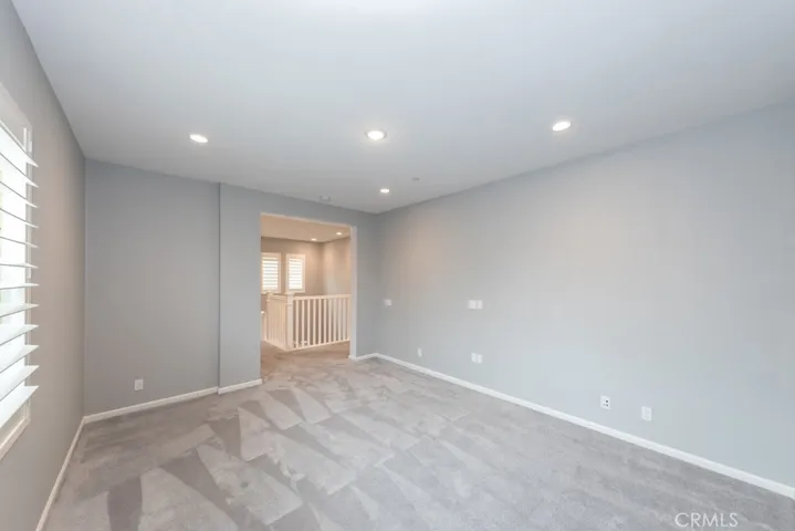 view from inside bonus room / "loft" area which overlooks front yard & street
