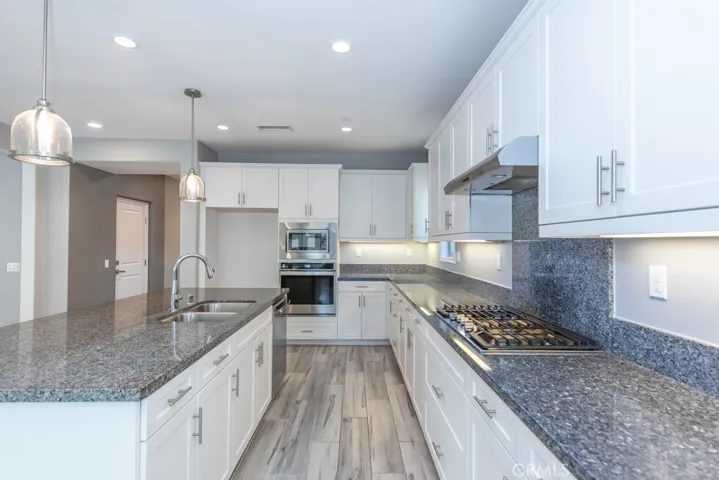 Huge kitchen with granite countertops and large island