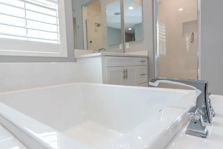  large soaking tub in primary ensuite bathroom