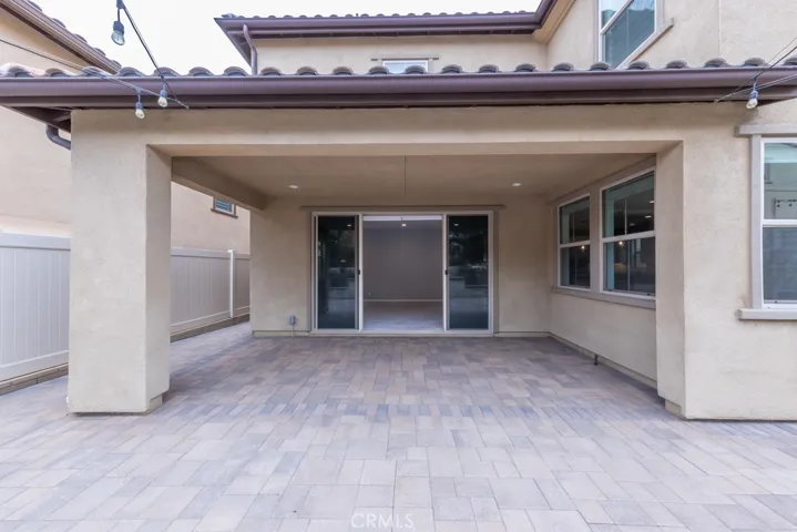 from waterfall looking into den through double sliding door entry