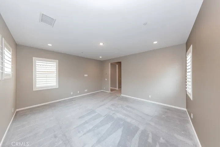 photo taken from SW corner of primary (4th) bedroom looking towards its entry and its own ensuite (4th) bathroom